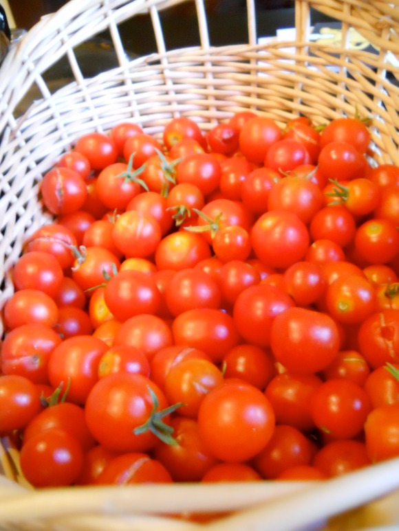 basket filled with red ripe cherry tomatoes